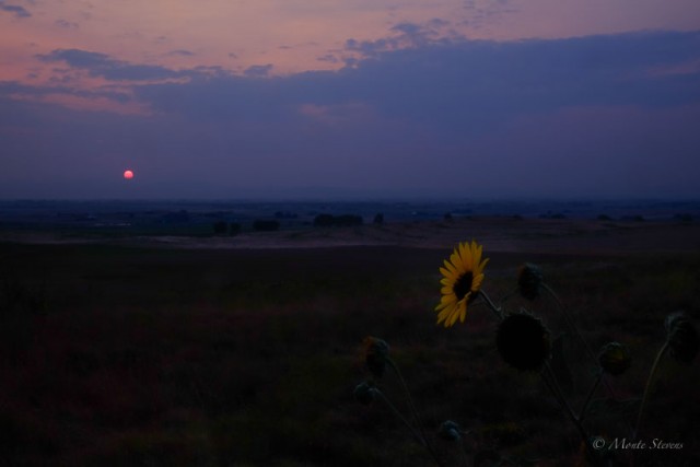 A red sun over the Rocky Mountains